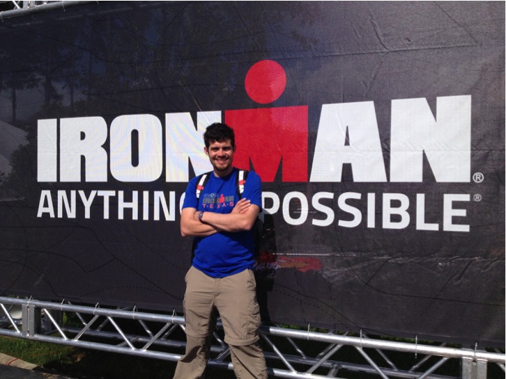 Photo of Dr. Rojas in front of an Ironman sign that say's Anything is Possible.  After Ironman Texas. 2014.